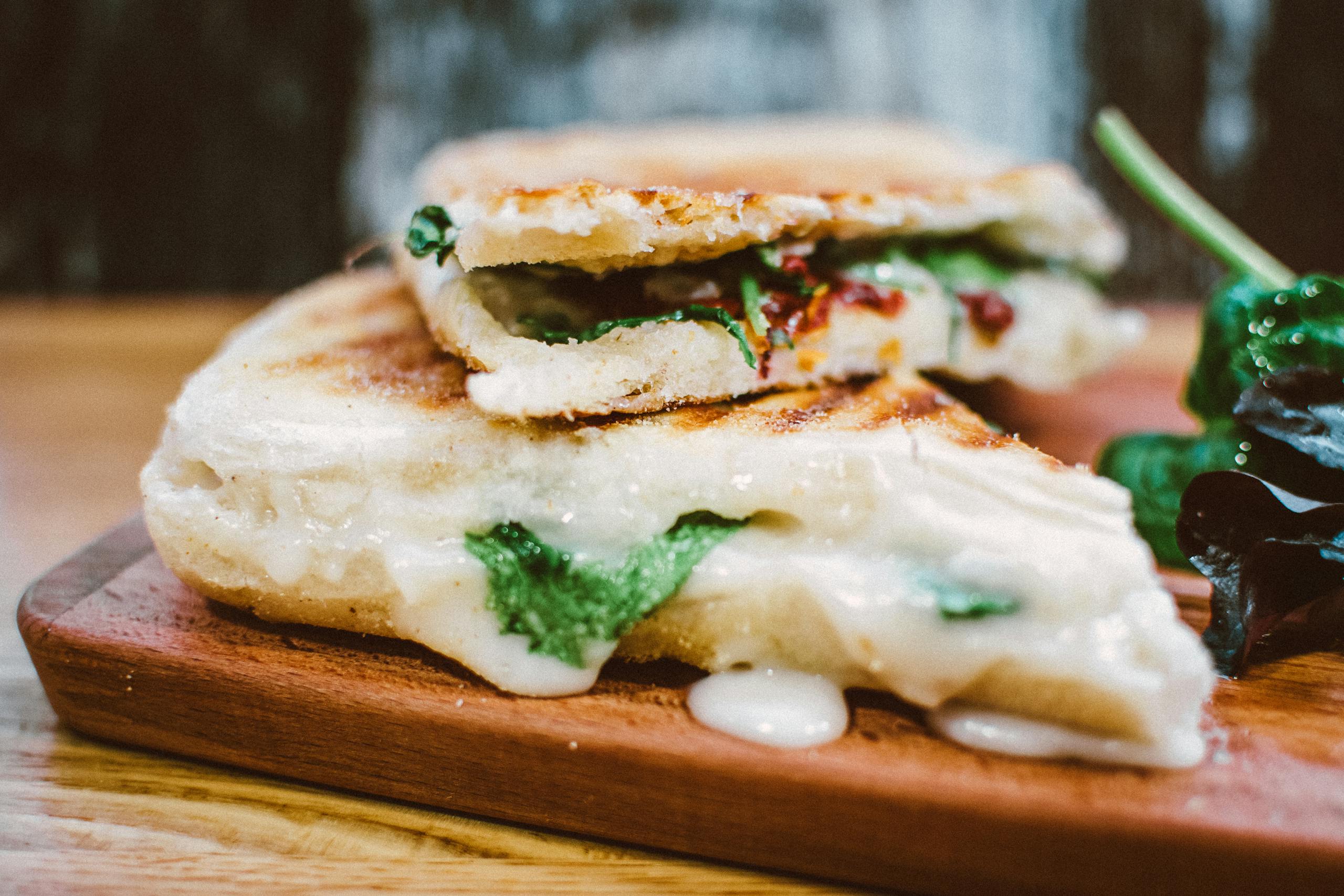 Delicious grilled panini loaded with melted cheese and fresh spinach, perfect for a satisfying meal.